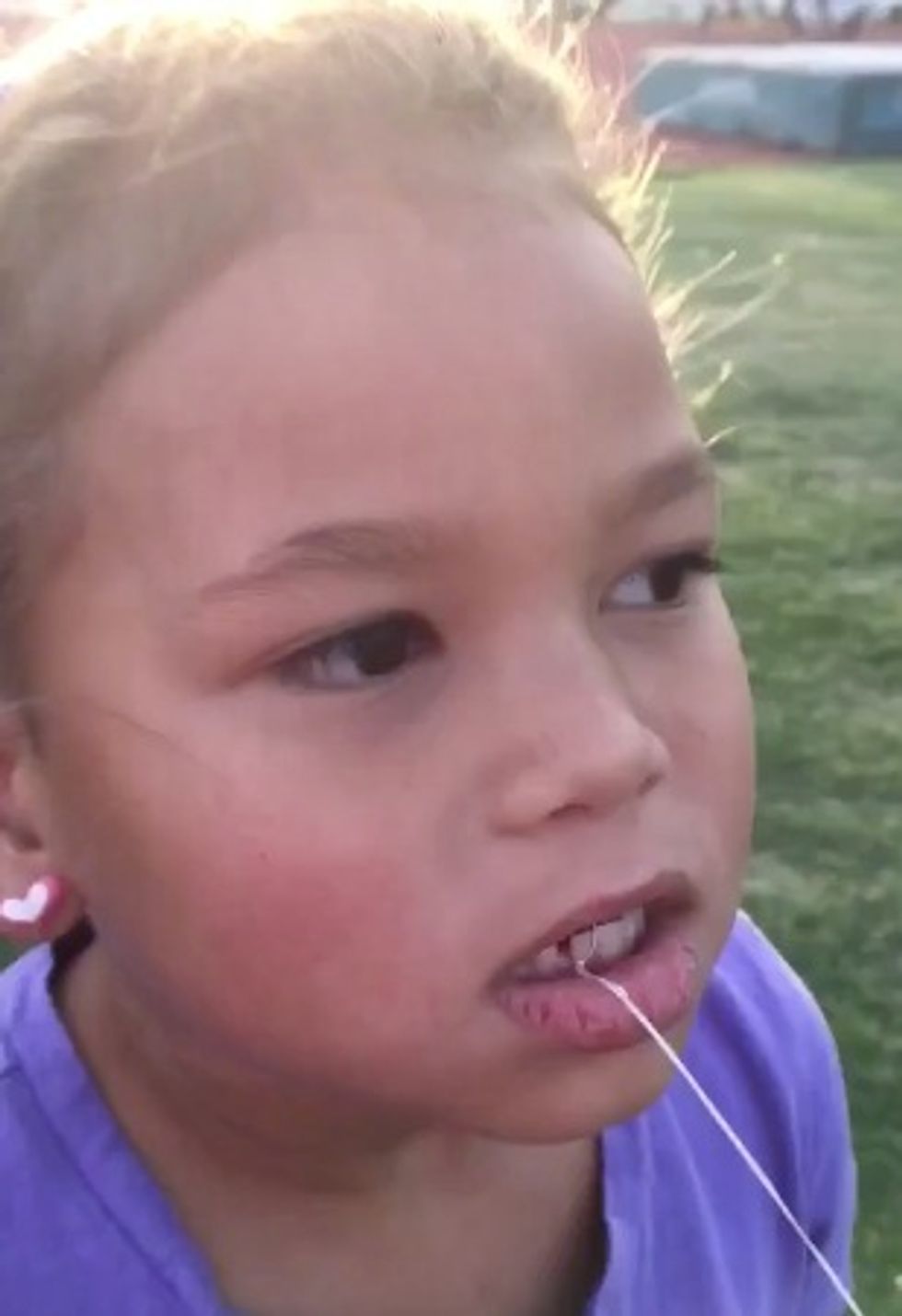 Only a Former Olympic Decathlete Would Pull His Daughter's Loose Tooth Out Like This
