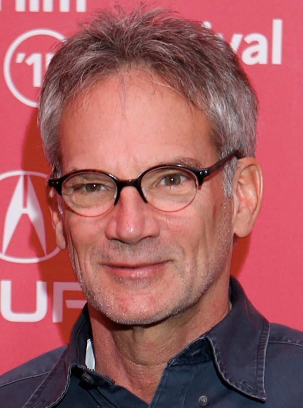 Intense Reaction to a Best-Selling Author Caught on Video Physically Taking Away a Critic's Microphone