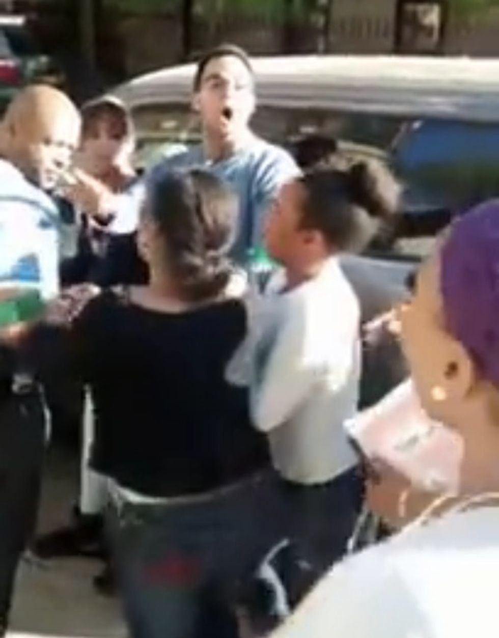Cop Caught on Video Trying to Handcuff a Teen Girl. But When an Angry Crowd Gathers, He Reacts in a Shocking Way.