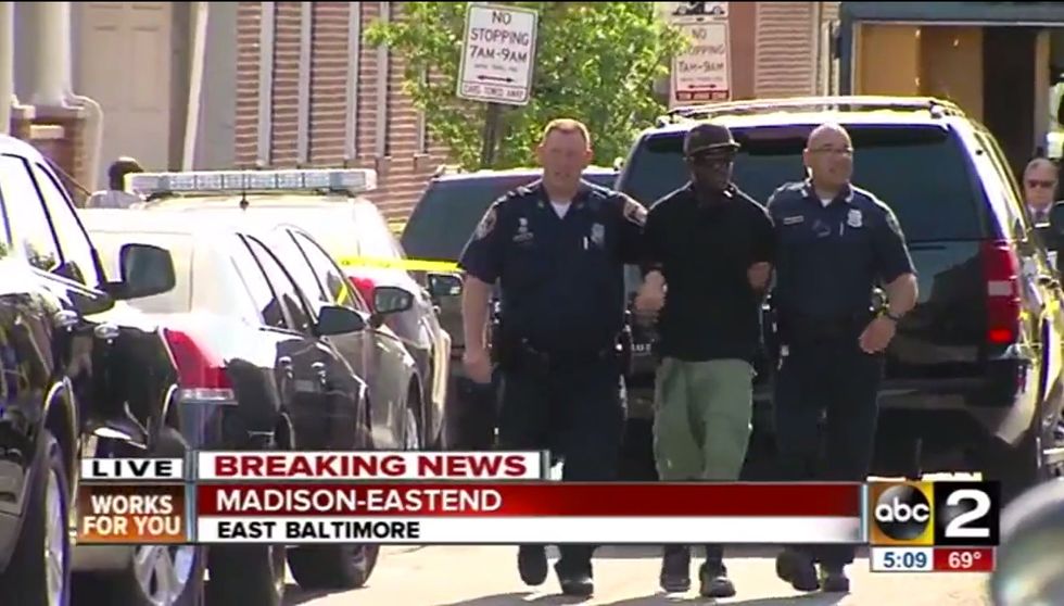 Pay Close Attention to What Handcuffed Baltimore Suspect Seems to Do After He Sees News Camera