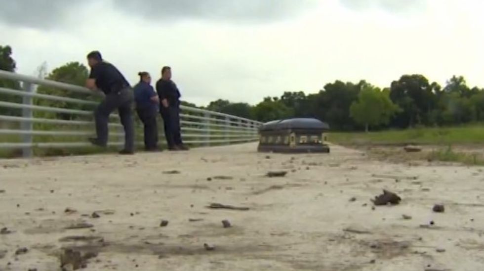 Unsettling Sight: Casket Pushed Out of the Ground, Carried Onto Bike Trail by Texas Flood Waters