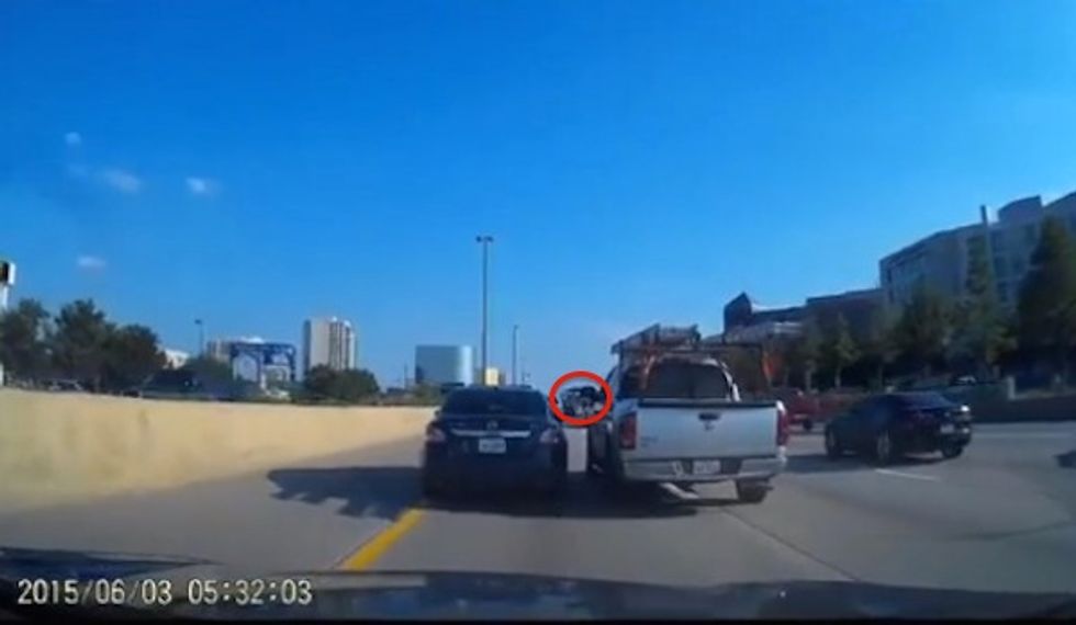 At 1:11 in This Video a Driver Seems to Point Something Out the Window That Brings Road Rage Battle to a Halt