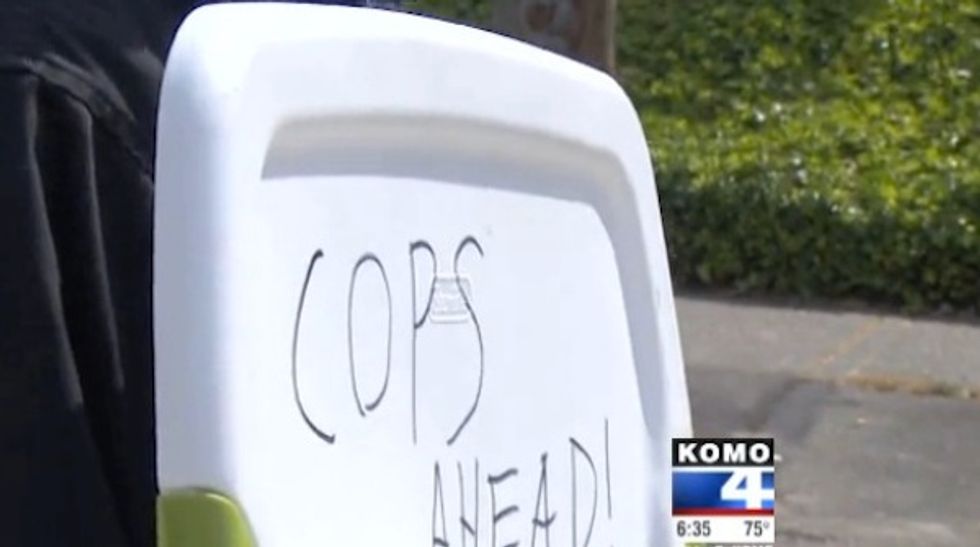 Seattle Man Holds Up a Sign Warning Other Drivers About ‘Cops Ahead.’ How Authorities Responded Has Him Accusing Them of ‘Twisting Laws\