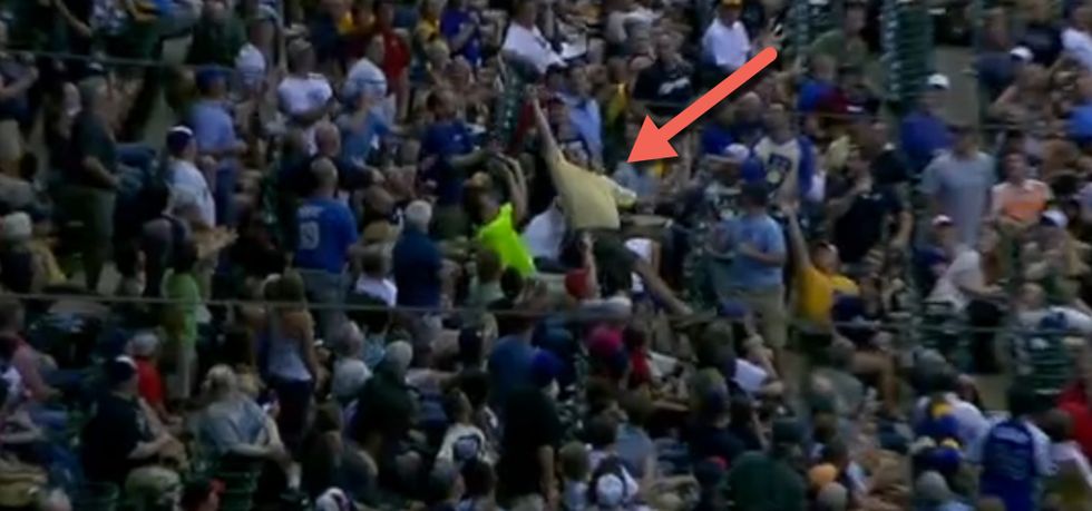 This Guy Is About to Miss a Foul Ball, and Give the Guy Behind Him Quite the Surprise