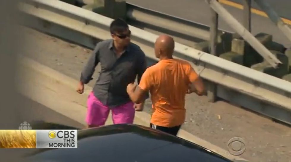 Watch How Police Officer Handles Unexpected Road Rage Incident That Unfolds in Middle of TV Interview