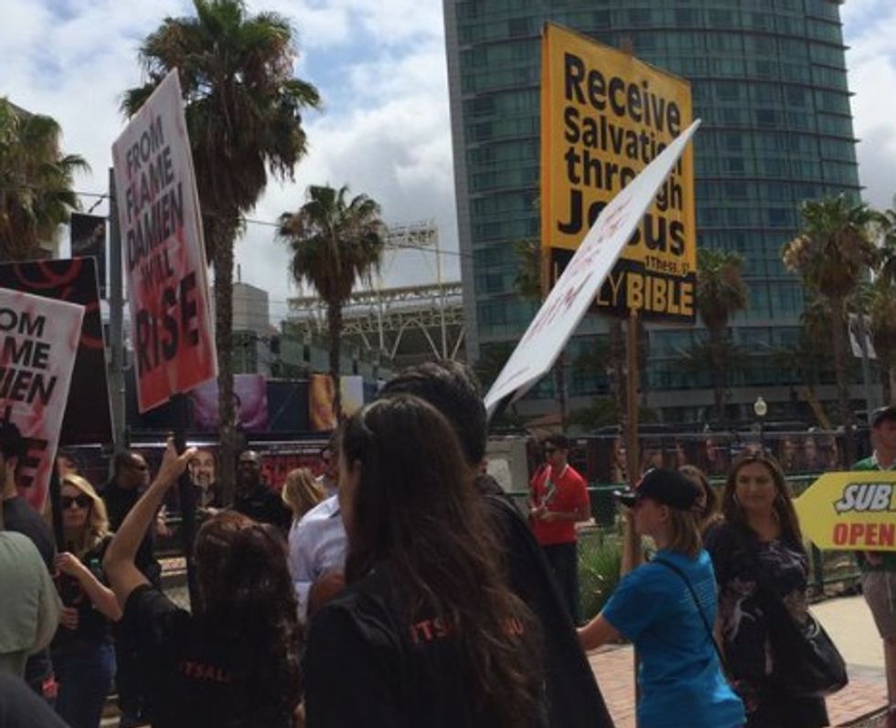Christians Picket Outside San Diego Comic Con Every Year — but Take a Close Look at the Signs These Other 'Protesters' Are Carrying