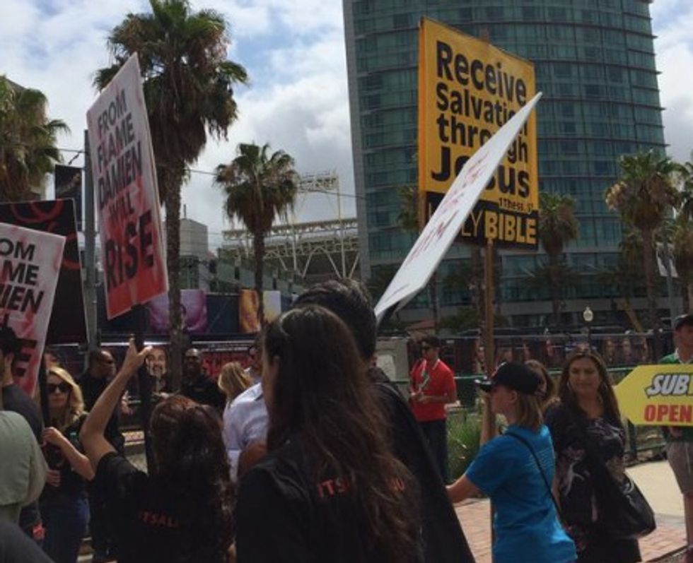 Christians Picket Outside San Diego Comic Con Every Year — but Take a Close Look at the Signs These Other 'Protesters' Are Carrying
