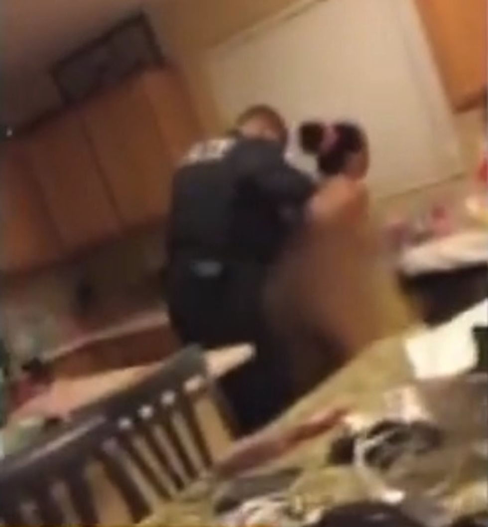 After Cop Illegally Enters Home, Video Captures Him Handcuffing Terrified Woman Who's Wearing Only a Towel — and Right in Front of Her Teen Daughter