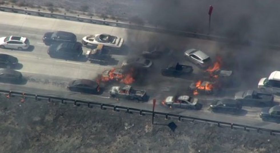 Chaos' As Vehicles Burn on Live Television After Wildfire Sweeps Across Southern California Freeway