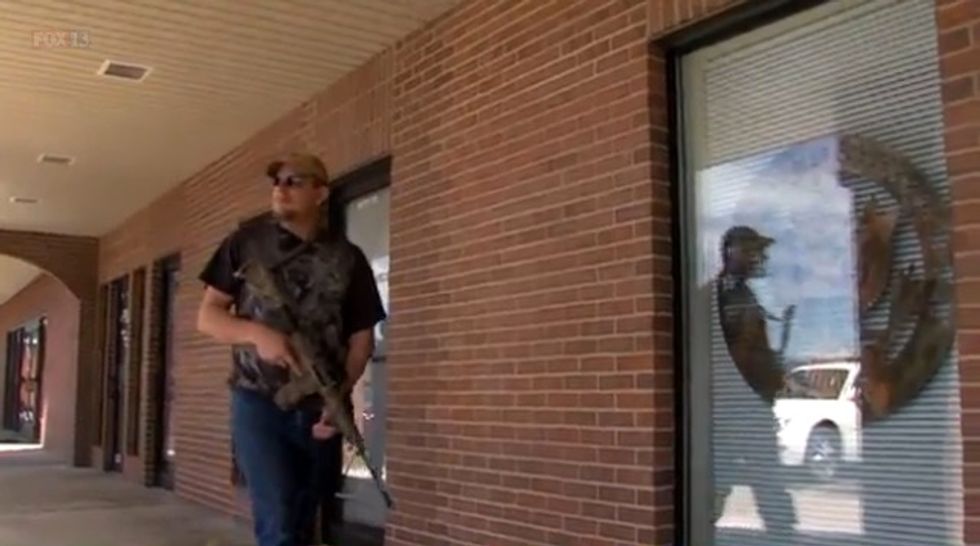 Armed Man Guarding Military Center Says Point He Wants to Make Can Be Conveyed in Four Brazen Words