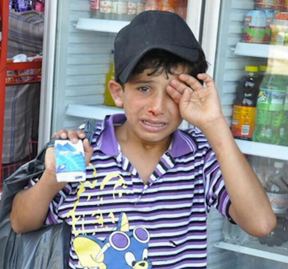 Photos Show the Moment a Syrian Boy Was Beaten Reportedly for Trying to Sell Tissues
