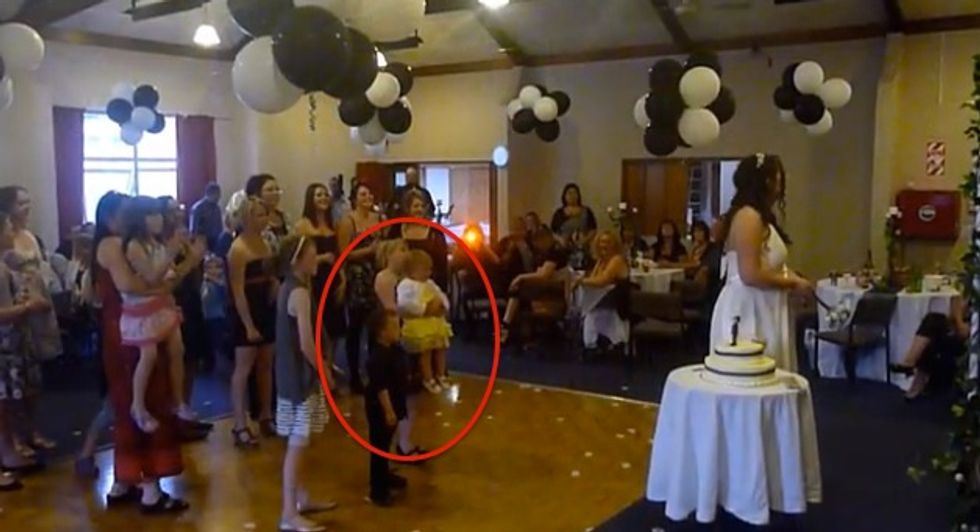 Look Closely at This Wedding Guest and You Can Probably Guess What Unfortunately Happened When the Bouquet Was Tossed