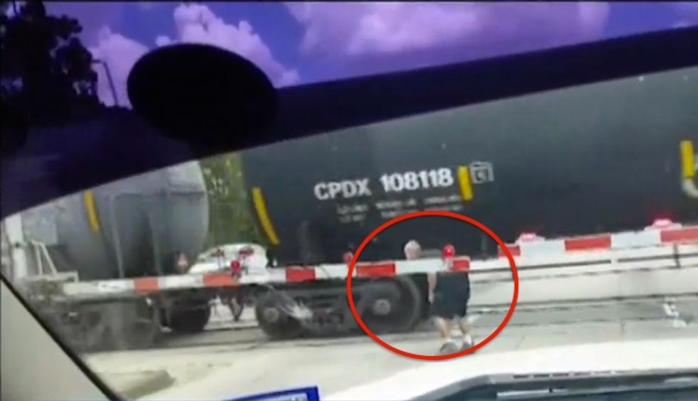 Man Next to This Moving Train Is About to Tempt Fate in a 'Crazy' Way