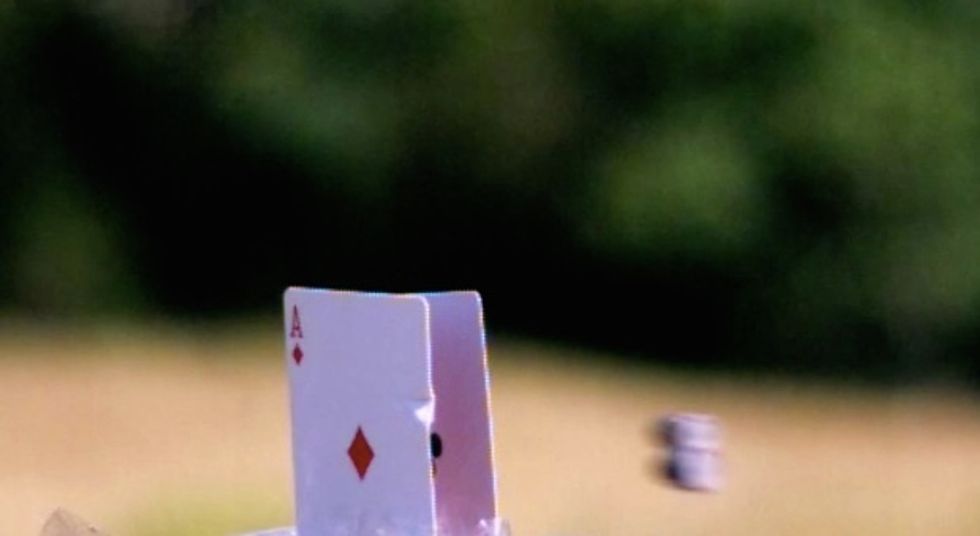 Awesome: Sharpshooter Splits Two Cards With Two Bullets…With One Shot