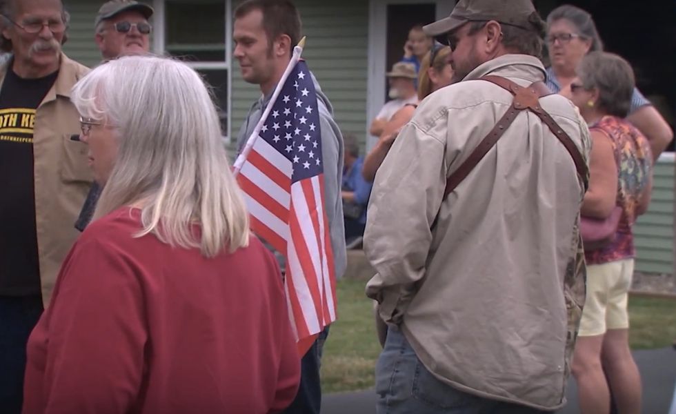 Sheriff Stands Guard With Residents Outside Navy Veteran's Home to Ensure His Guns Aren't Confiscated – Here's the Backstory