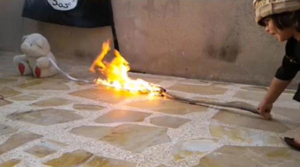 That Jihadist Tot Is Back Inflicting New Sadism on His Teddy Bear in New Shock Photos