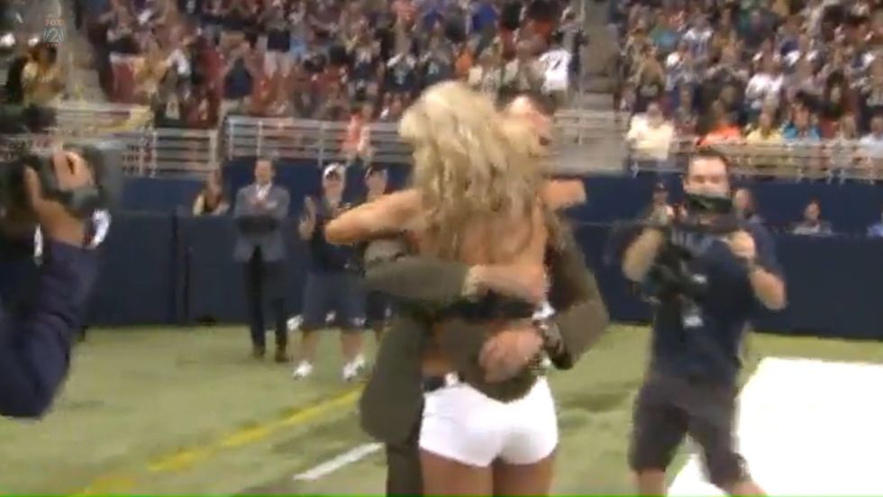 St. Louis Rams Cheerleader Turns Around During First-Quarter Timeout to Find an Amazing Surprise in Uniform