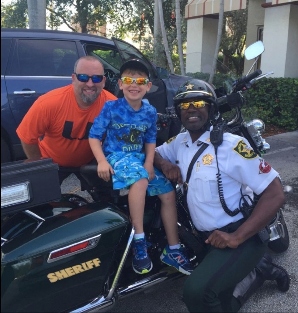 Sheriff's Deputy Was Standing in Line for Breakfast When a Little Boy's Action Catches Him Off-Guard — and Brings Him to Tears