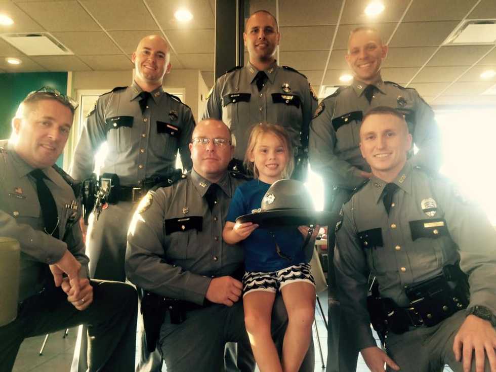 5-Year-Old Girl Notices Group of Police Officers Mourning the Death of Their Friend So She Decides to 'Put Smiles on Their Faces'