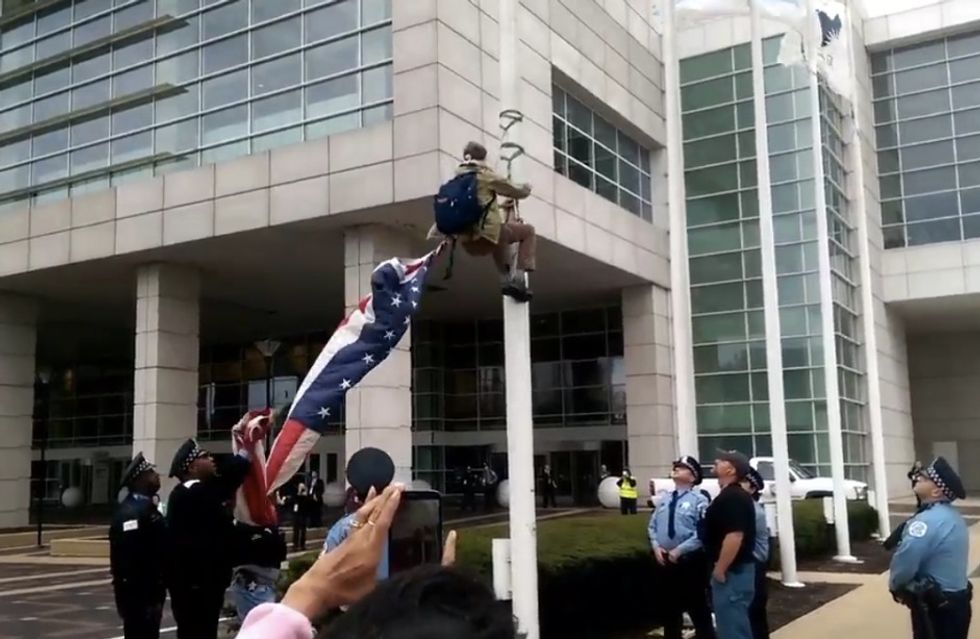 Black Lives Matter Protester Outside Police Chiefs' Convention Takes Down American Flag — Check Out What He Raises in Its Place