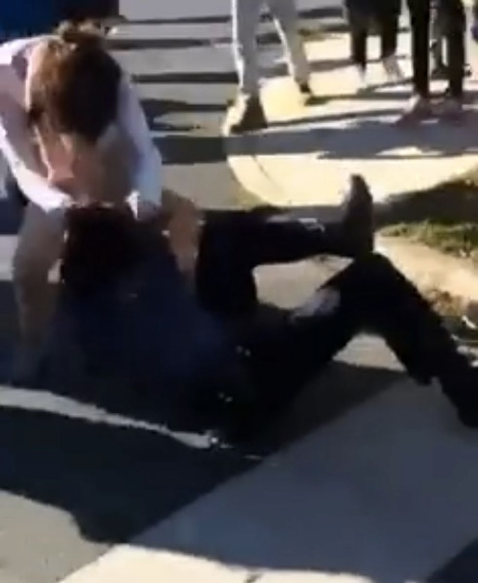 Student Caught on Video Pummeling Cop While Crowd Roars During Massive After-School Brawl That Injured Four Officers as Up to 200 Students Gathered