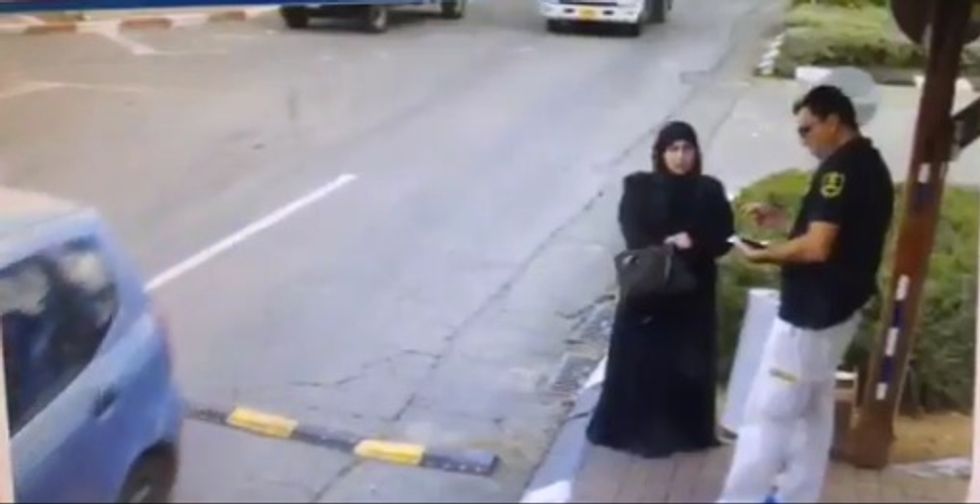 Israeli Security Guard Doesn't Know What This Woman Is About to Pull from Her Purse
