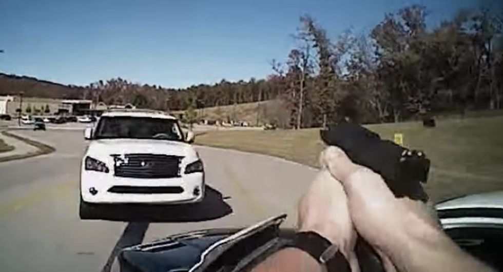 Body Camera Records Officer Firing Two Shots as Stolen SUV Bears Down on Him, Slamming Into His Patrol Car