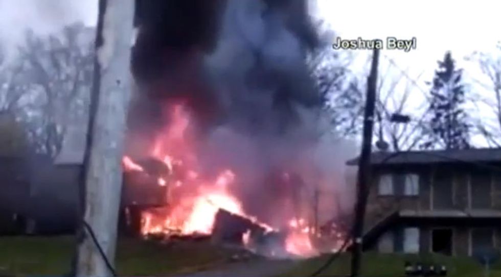 Nine Dead After Business Jet Clips Utility Wire, Crashes Into Apartment Building in Ohio