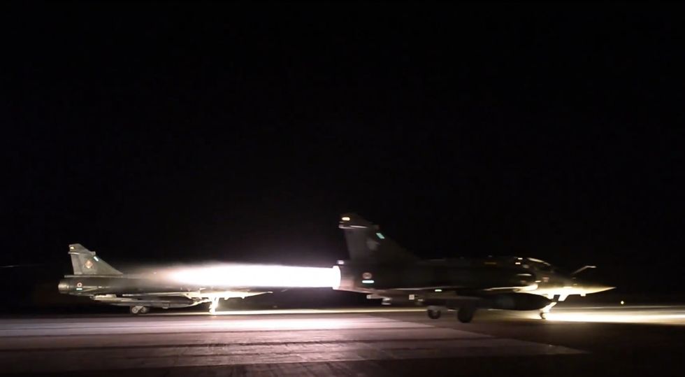 France Launches 'Massive' Air Strikes Against Islamic State HQ as Hunt Continues for More Members of Sleeper Cell That Carried Out Paris Terror Attacks