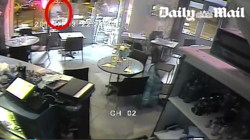 Chilling New Video from Paris Restaurant Shows Terrorist Aim Point-Blank at Woman and Pull the Trigger — and She's Alive
