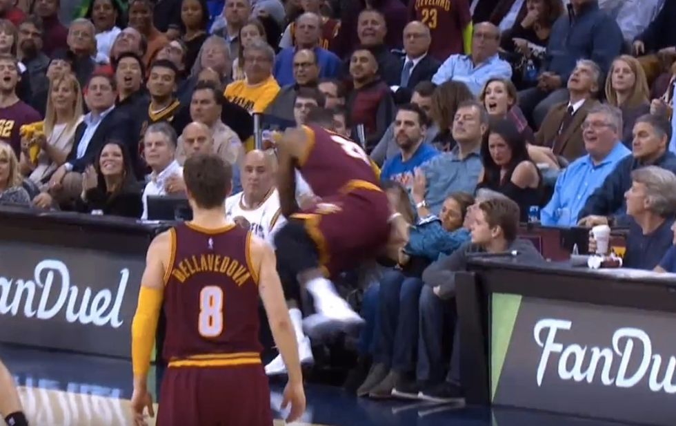 LeBron James Crashes Into Crowd Chasing Loose Ball, Lands on and Injures Wife of Golf Star Jason Day