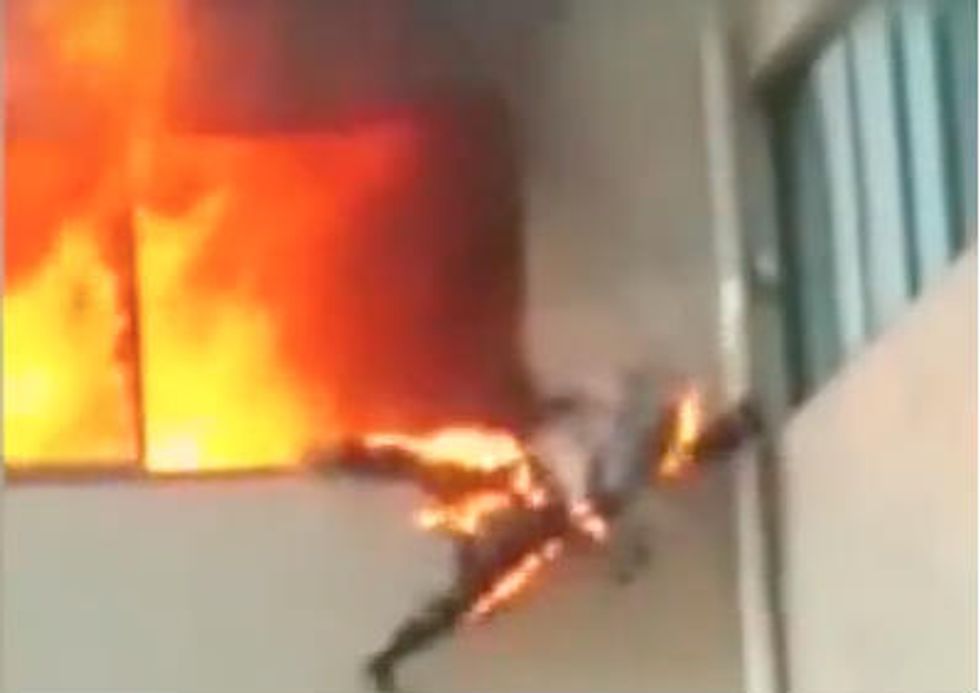 Stunning Video Shows Firefighter Jump Out of Burning Building in China – Incredibly, He Escaped With Only a Few Minor Burns
