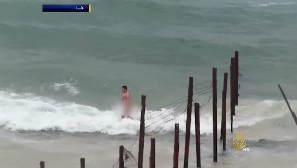 Shocking Video Shows Egyptian Forces Shoot Dozens of Bullets at Naked Man Wading Across Sea Border