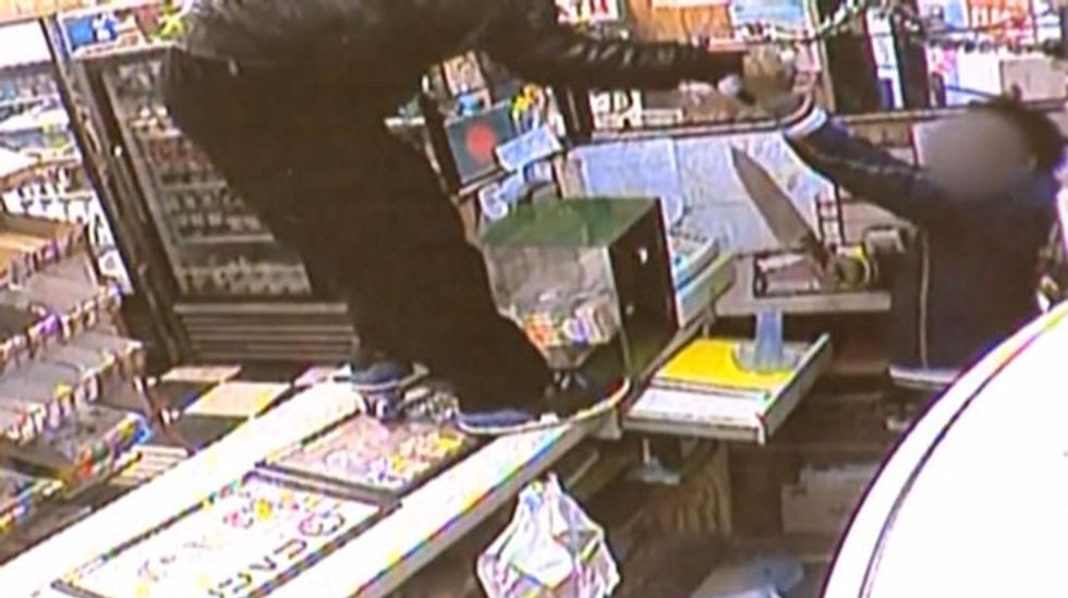 Raw Surveillance Footage: Store Clerk Fights Knife-Wielding Robber for More Than a Minute