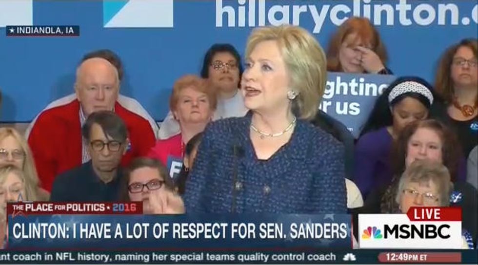 Pay Attention to the Guy in the Glasses Sitting Directly Behind Hillary Clinton During Campaign Event