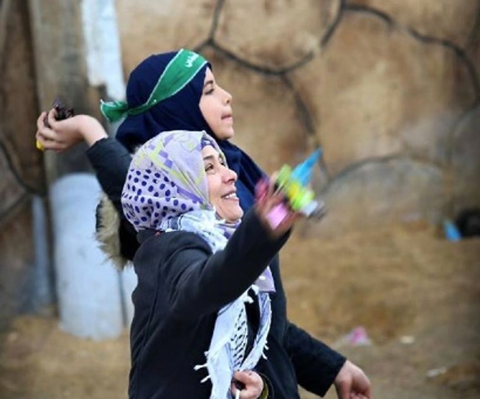 These Ladies Are Throwing Candy in Celebration. The Reason Why May Disgust You.