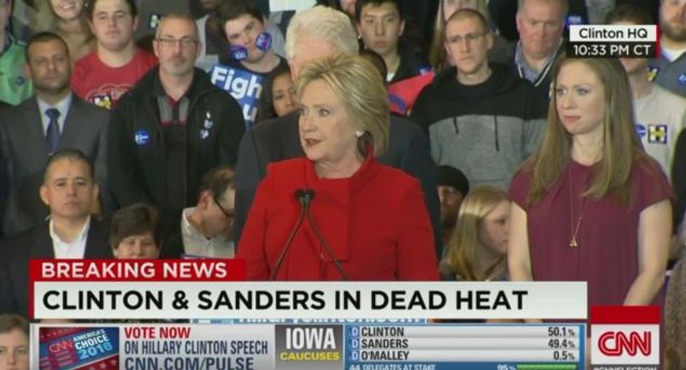 Did You Notice the Guy Standing Behind Clinton as She Delivered Her Iowa Victory Speech? The Internet Did.