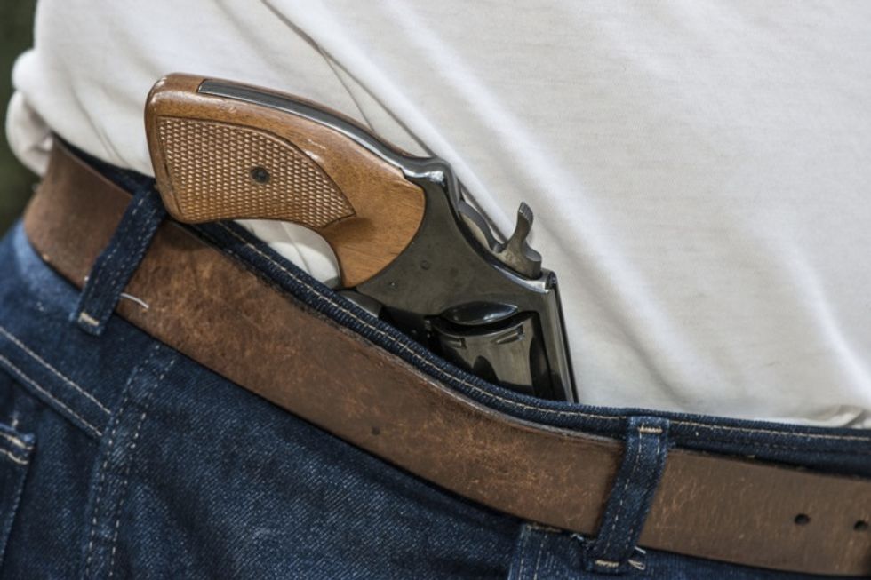 Officer Is Attacked and Then Surrounded by '40 or 50' Teenagers. But Just When It Looks Like the Cop Is 'Dead Meat,' a Gun Owner Opens His Front Door.
