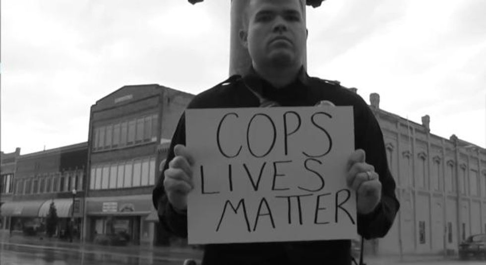 Police Officer Placed on Unpaid Leave After Appearing in Video Holding 'Cop Lives Matter' Sign