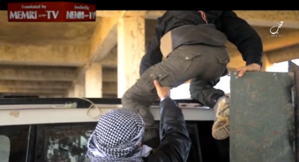 Behind This Innocent-Looking Image of a Father and Son Lurks One of the Sickest Accounts to Date From the Islamic State