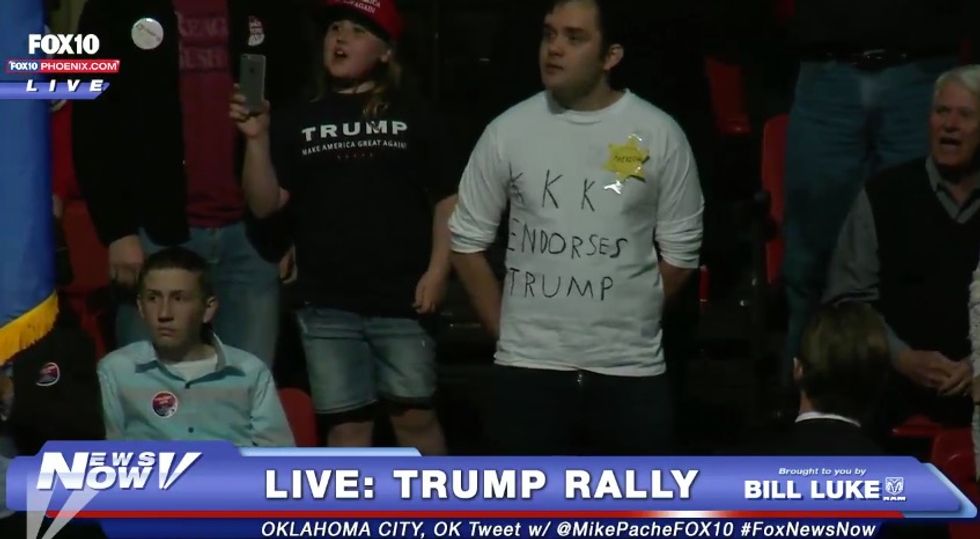 Watch What Happens When Protester With 'KKK Endorses Trump' Shirt Stands Up, Sticks Tongue At Trump During Rally