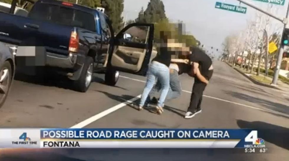 Insane Road Rage Fight Unfolds in Street as Man Drags Passenger Out of Truck  — and Keep Your Eye on Female Driver