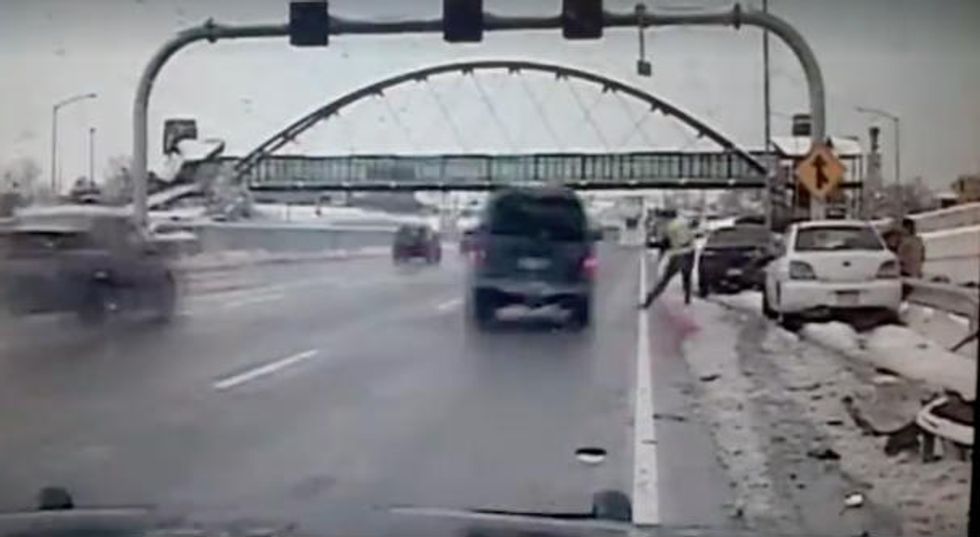 Dashcam Video Captures Moment Officer Investigating Roadside Crash Comes Just Inches From Tragedy