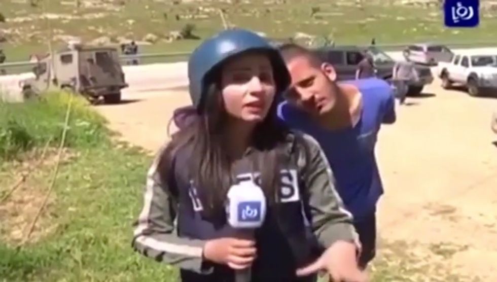Watch How Arab Television Reporter Reacts When Israeli Bystander Interrupts Her Live Report with Funny Faces and Chanting