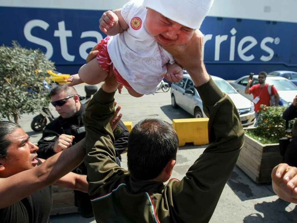 Migrant Man Caught on Video Grabbing Infant and Holding Her Above His Head During Protest — and Allegedly Issues Awful Threat to Police