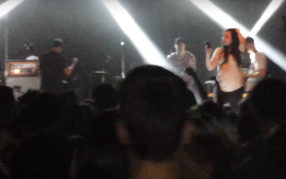 Fan Sneaks Onstage, Fixes Her Hair for Perfect Selfie — but Before She Can Snap It, the Band’s Frontman Gives Her a Different Kind of Memory
