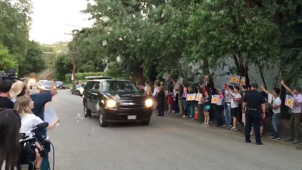 Sanders Supporters Throw Cash at Clinton's Motorcade On The Way to Fundraiser with George Clooney