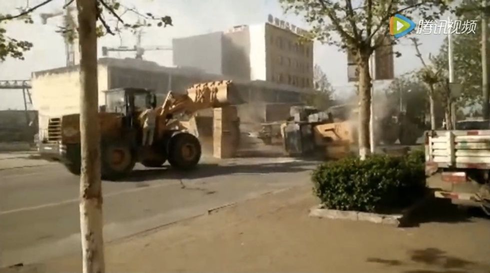 Watch: Angry Chinese Construction Workers Use Bulldozers in Demolition Derby-Style Clash