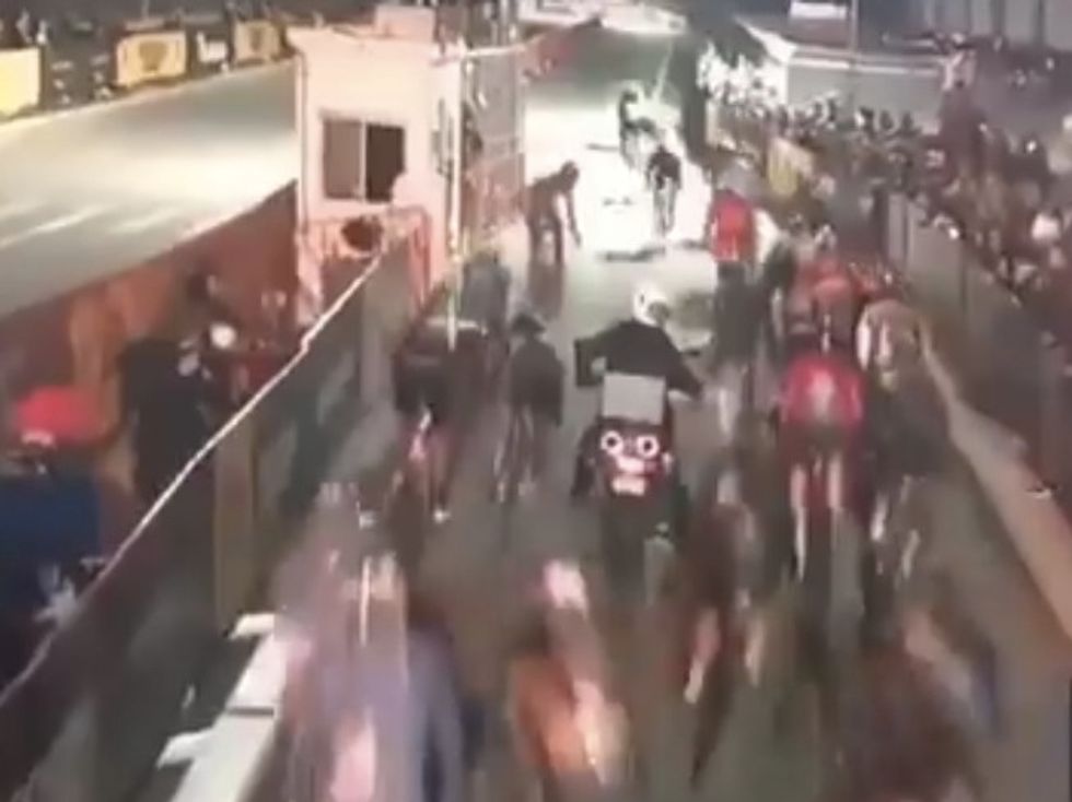 Motorcycle Stalls in Front of Furiously Pedaling Bike Racers — and Then the Inevitable Comes to Pass