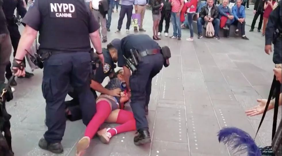 Topless Times Square Woman Smiles As She Shoves Police Officer, Gets Immediately Arrested